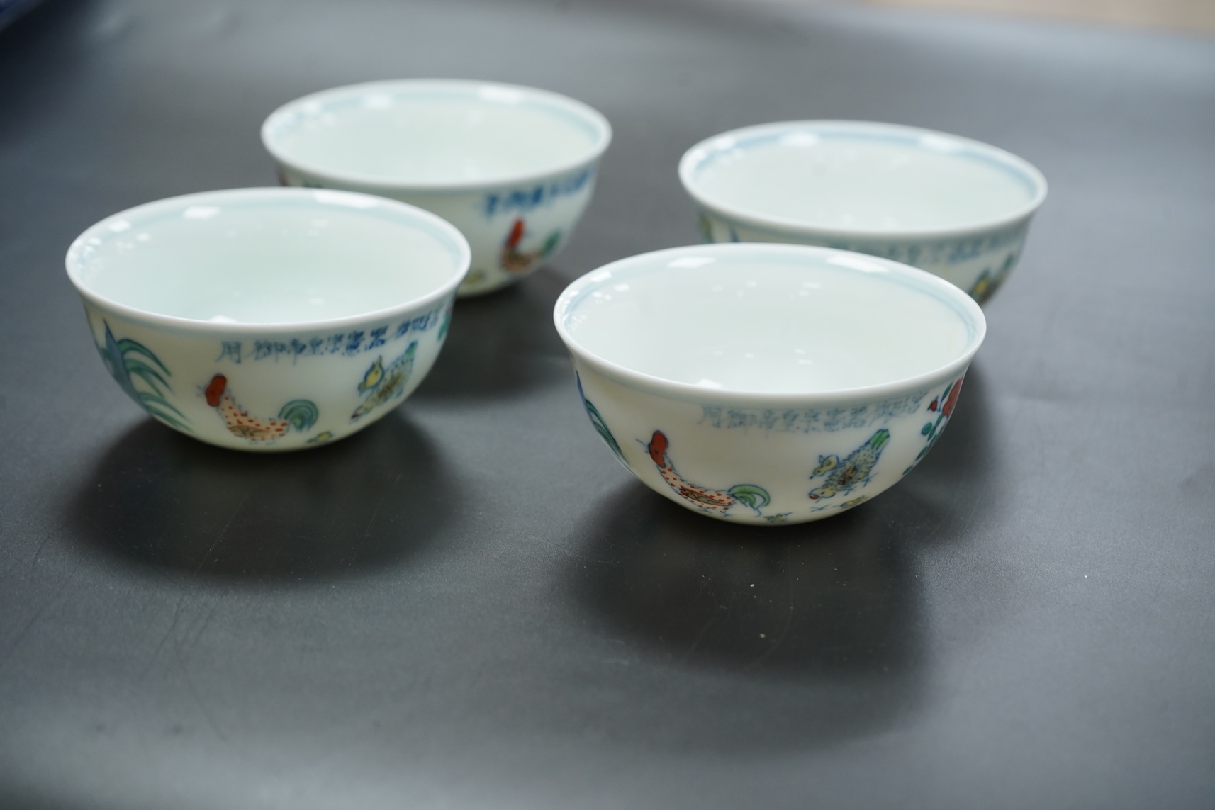 Four Chinese porcelain Wucai tea bowls, 8cm in diameter
